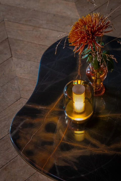 Humble Firefly lamp on marble table